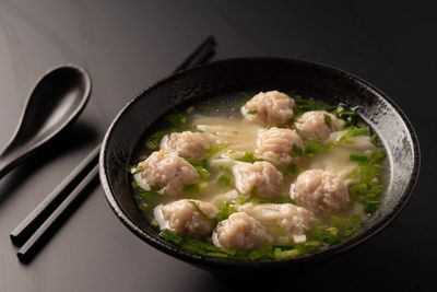 Close-up of food in bowl against black background