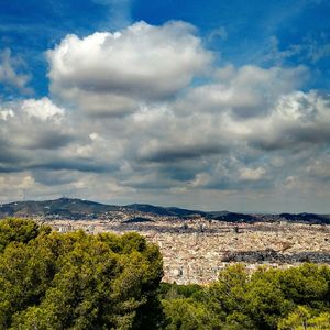 High angle view of mountain against cloudy sky