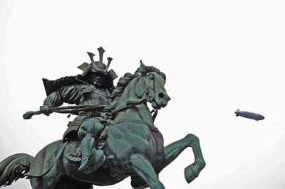 Low angle view of statue against clear sky