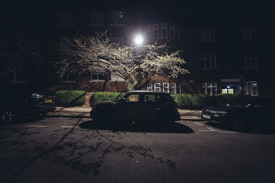 Illuminated city street at night