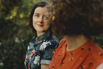 Portrait of woman standing outdoors