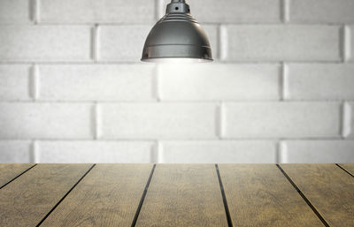 Close-up of light bulb on wall