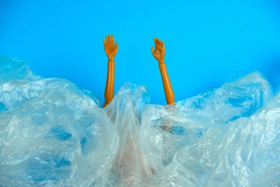 Close-up of ice cream over sea against blue background