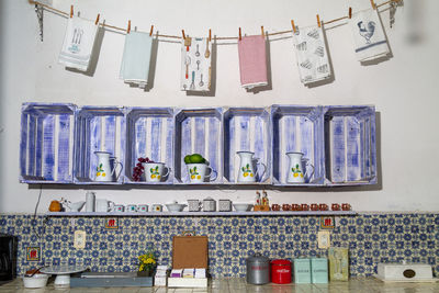 Low angle view of clothes hanging on wall at home