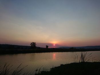 Scenic view of lake during sunset