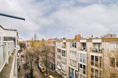 High angle view of buildings in city against sky