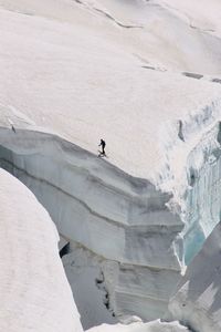 High angle view of man skiing on cliff