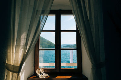 Sea seen through window at home