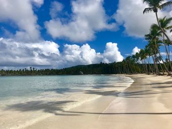 View of beach against cloudy sky