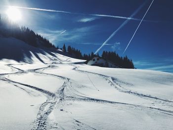 Scenic view of snow covered mountain against sky