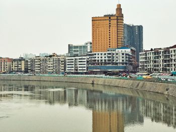 Modern cityscape against clear sky