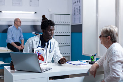 Female doctor working in office