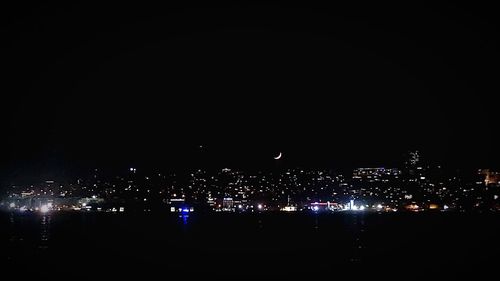 Illuminated buildings in city at night