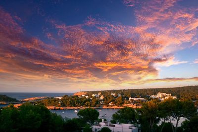 Scenic view of residential district against sky