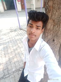 Portrait of young man standing outdoors