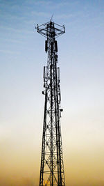 Low angle view of communications tower against sky