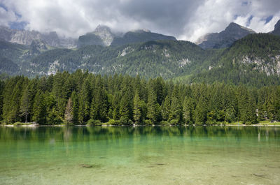 Scenic view of lake and mountains against sky