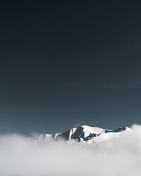 Scenic view of snow covered mountain against sky