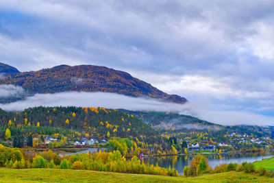 Wispy clouds over the village of hafslo, norway in the fall 