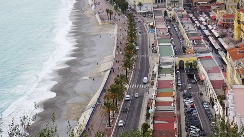 High angle view of city by sea