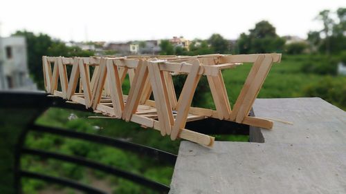 Close-up of chairs on table