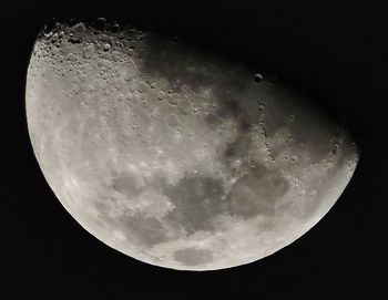 Low angle view of half moon against sky at night