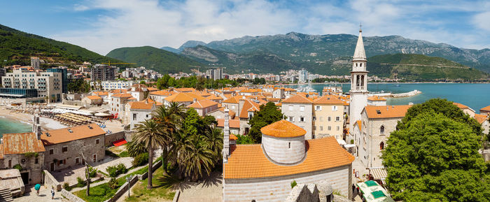 High angle view of town against cloudy sky