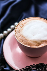 Close-up of cappuccino on table