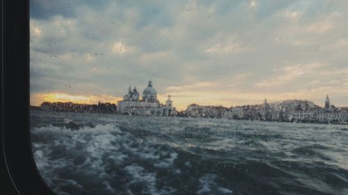 Panoramic view of cityscape against sky during sunset