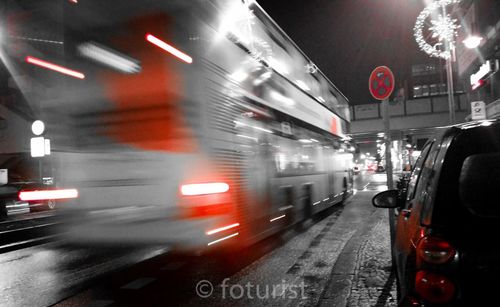 Traffic on road in city at night