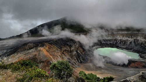 Smoke emitting from volcanic landscape
