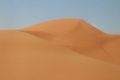 Scenic view of desert against clear sky