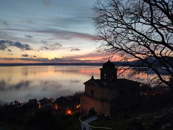 Scenic view of buildings against sky during sunset