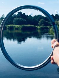 Reflection of person and trees in water