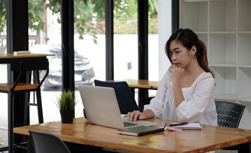 Woman working on table
