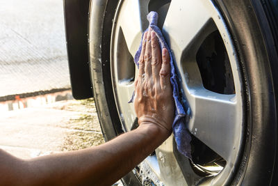 Close-up of hand in car