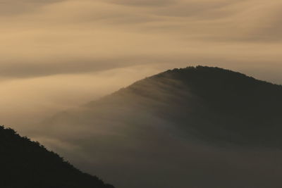 Low angle view of mountain against sky during sunset