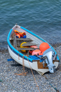 High angle view of motorboat moored at beach