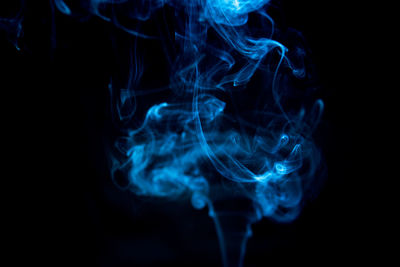 Close-up of smoke against black background