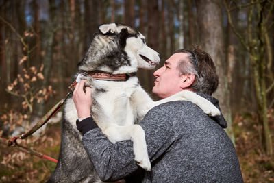 Side view of woman with dog