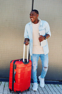 Portrait of young man standing on street