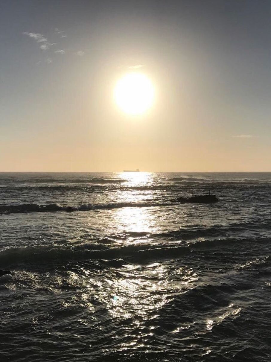 SCENIC VIEW OF SEA AGAINST SKY AT SUNSET