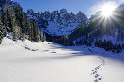 Scenic view of snowcapped mountains against sky during winter