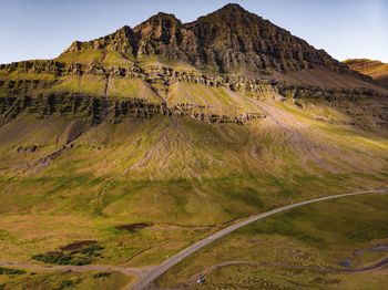 Scenic view of arid landscape against sky