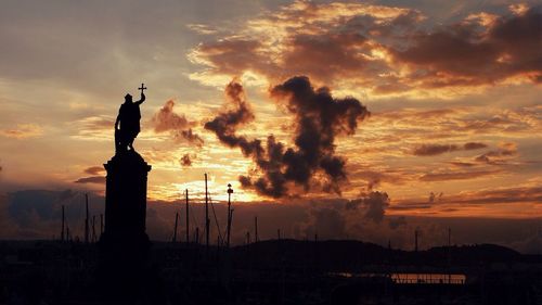 Silhouette of landscape against dramatic sky