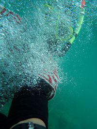 Close-up of person swimming in sea