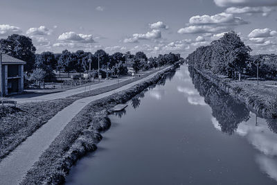 Scenic view of river against sky during winter