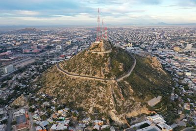 High angle view of city against cloudy sky