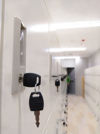 Close-up of electric light on wall in building