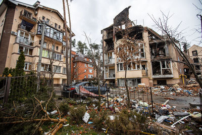 Destroyed buildings on the streets of irpen. broken  windows. buildings after being hit by missiles.